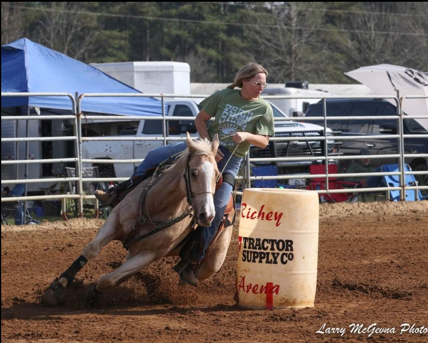 woman on barrel racing horse